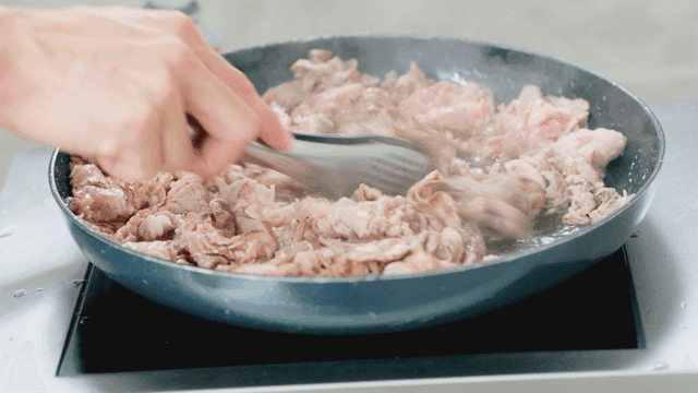Meat being cooked in a pan