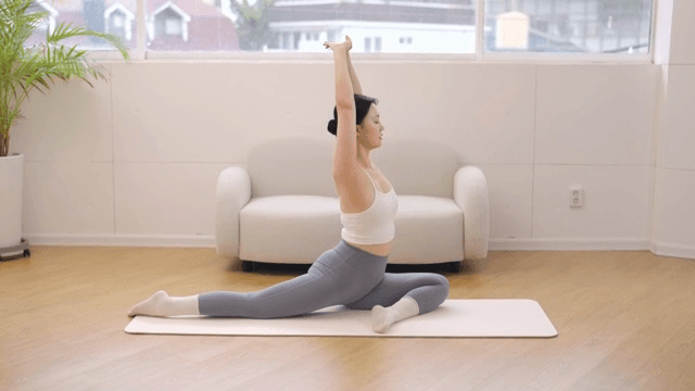 Woman practicing yoga indoors