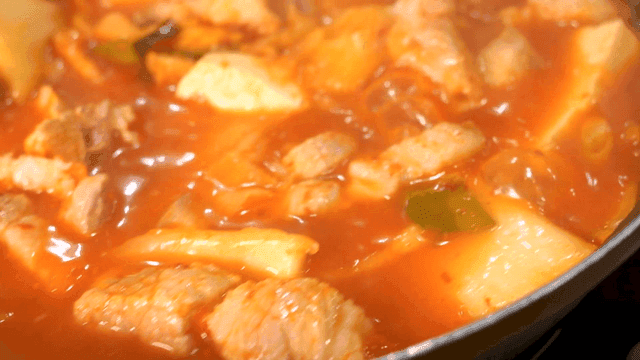 Boiling kimchi stew with pork and tofu in pot