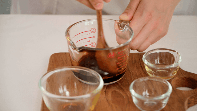 Mixing sauce in a measuring cup