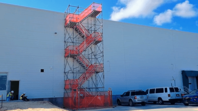 Construction site with scaffolding and workers