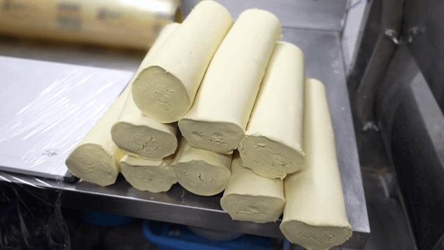 Dough being prepared in a kitchen