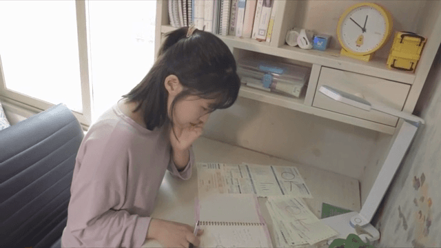 Woman with a lot of thoughts looking at a bill