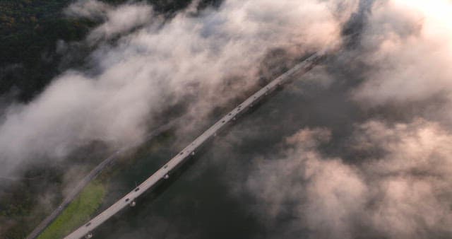 Road shrouded in morning mist