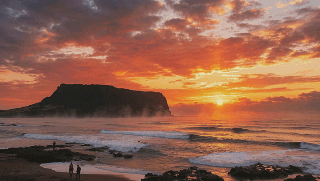 Sunrise over the ocean with a rocky shore
