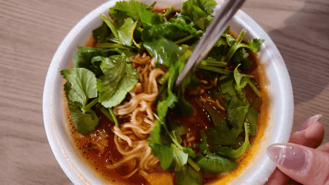 Cup noodles mixed with fresh cilantro