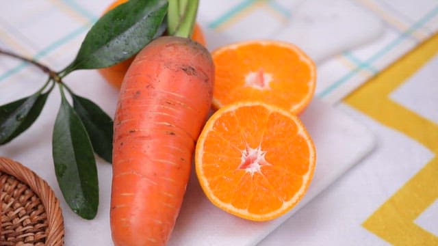 Carrot and carrot juice on a table