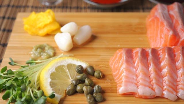 Fresh salmon sashimi served with ingredients