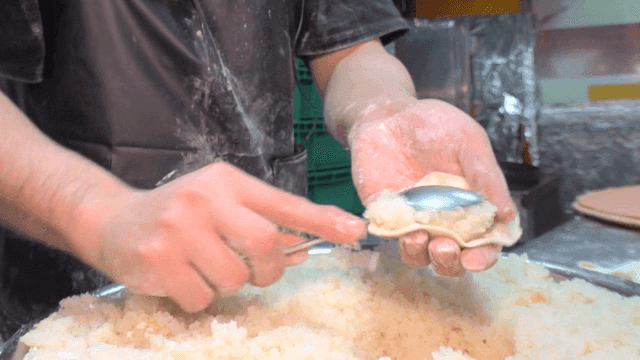 Filling dumpling wrappers with minced glass noodles