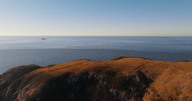 Coastal Cliffs Overlooking Calm Sea