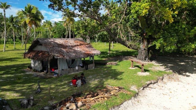 Beach with emerald water and huts