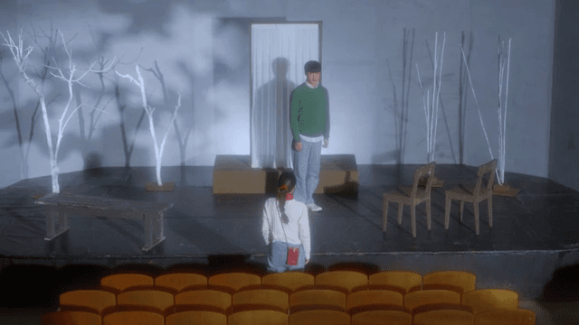 Theater stage with actors rehearsing