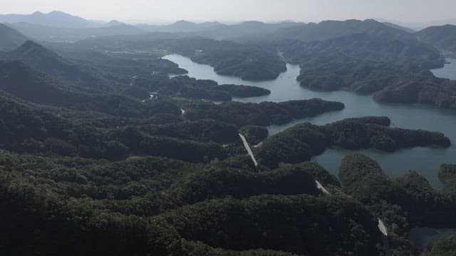 Serene Lakes Amidst Rolling and Lush Forested Hills