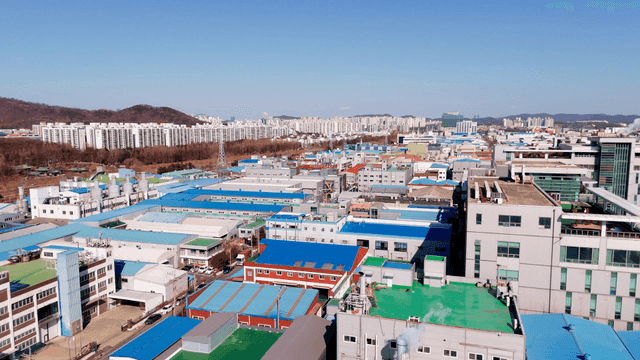 Industrial area with city skyline