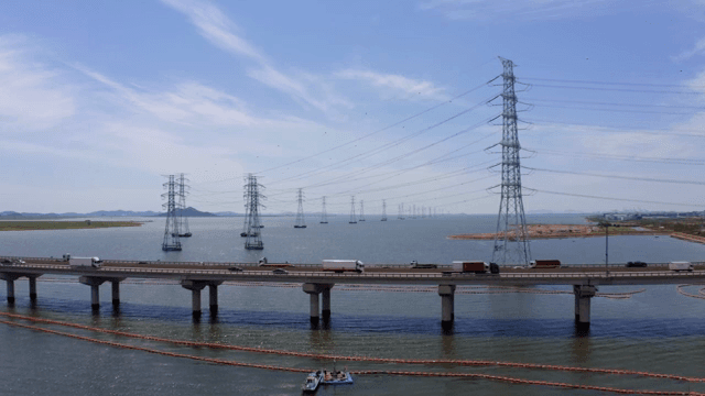 Bridge and cars over the blue river