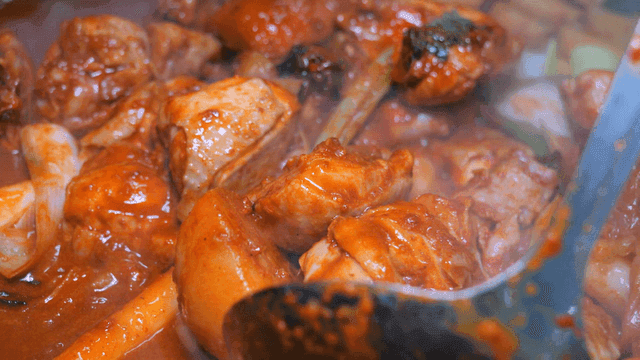 Spicy braised chicken boiling in spicy broth