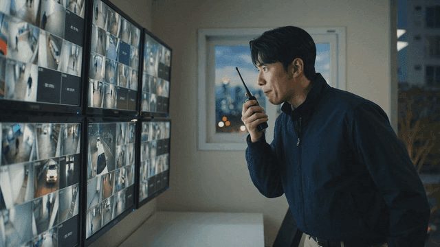 Security guard monitoring CCTV screens