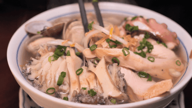 Chopsticks for scooping up nourishing seafood rice noodles