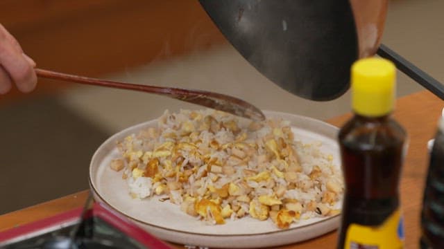 Cooking fried rice with eggs and vegetables