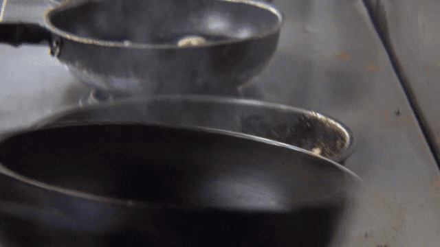 Cooking with flames in a kitchen