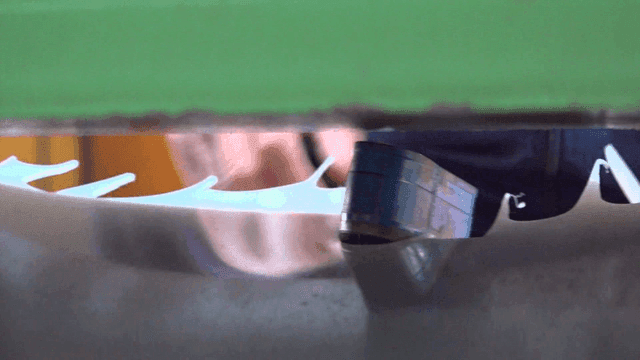 Worker operating metal cutting machine