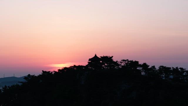 Sunset Silhouette of Traditional Pavilion