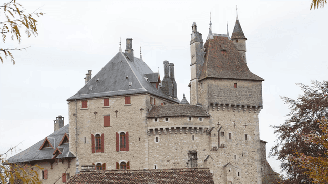 Historic European castle with red windows