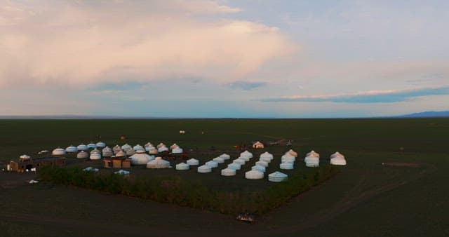 Serene landscape with traditional yurts