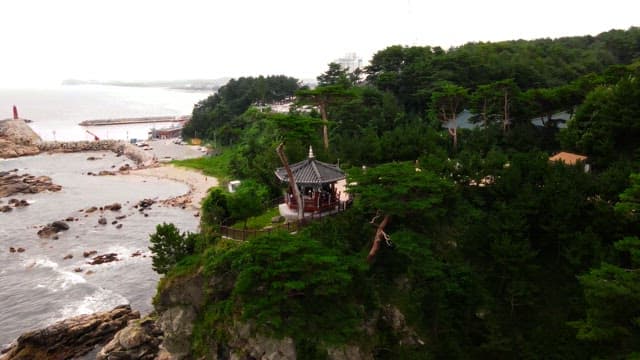 Traditional Korean temple on a coastal cliff