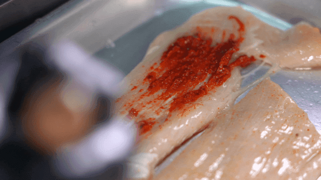 Gochujang seasoning applied to raw beef tripe