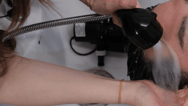 Hair washing at a salon sink