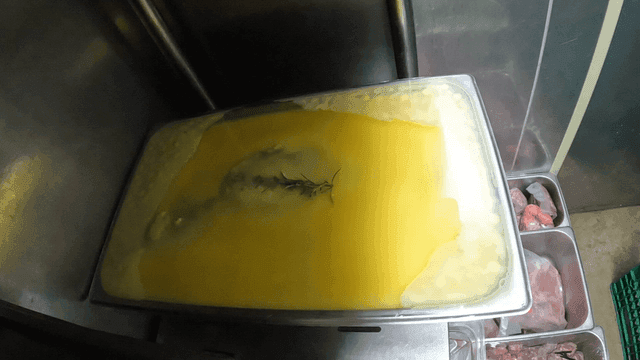 Fragrant herbs in yellow butter