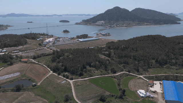 Scenery of farm by sea