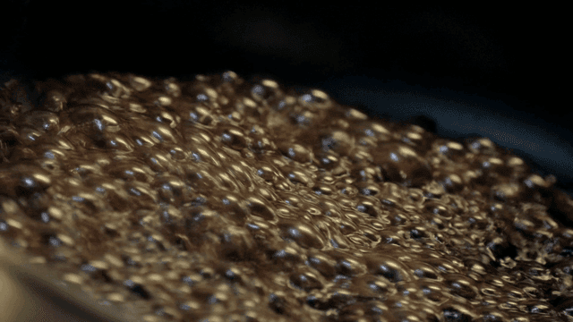 Bubbling sauce in a pot on the stove