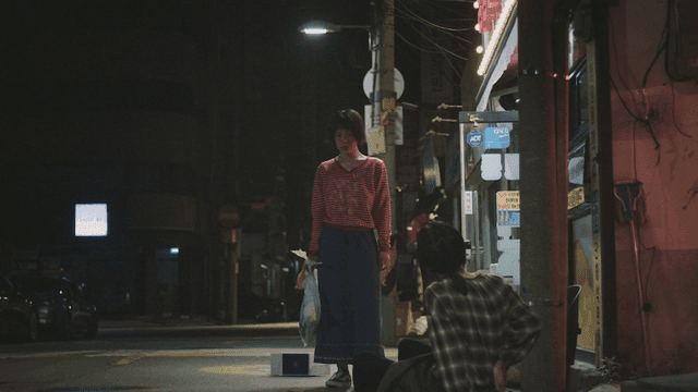 Mother fallen in front of a store and daughter watching