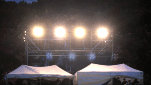 Temporary stage lighting and tents for night events