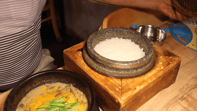 Meal with hot stone pot rice and loach soup