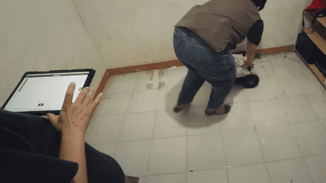 People exploring room using machines