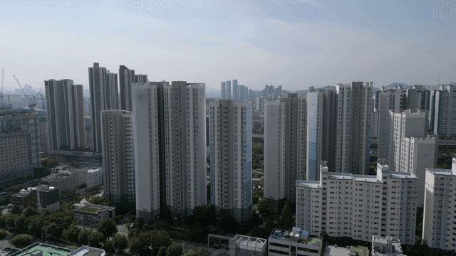 A cityscape with tall apartment buildings