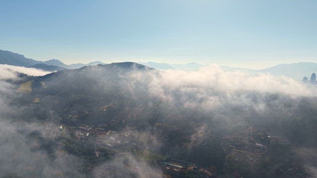 Mountains and cityscape shrouded in mist