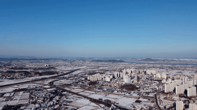 Aerial view of a snowy cityscape