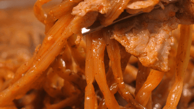 Bite of pork backbone stew with sweet potato stems