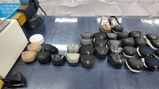 Various shoe parts arranged on a table