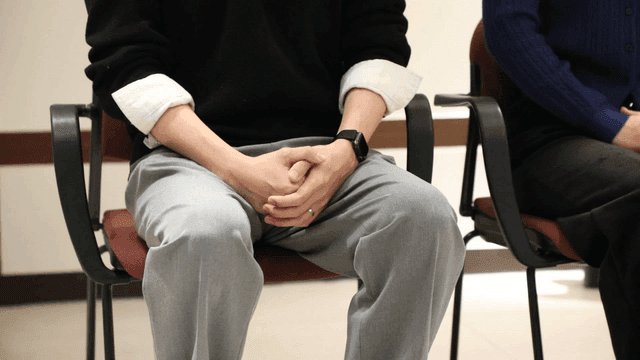 Interviewees sitting on chairs