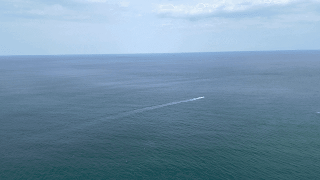 Boat cruising on the vast ocean