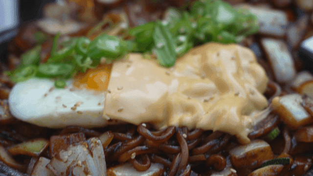 Jajangmyeon topped with egg and cheese