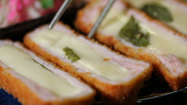 Chopstickful of pork cutlet with rich cheese