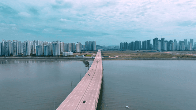 Bridge leading to modern city skyline