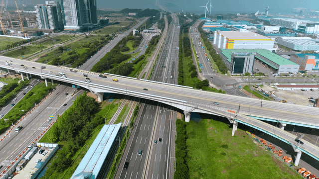 Aerial view of a busy highway and cityscape