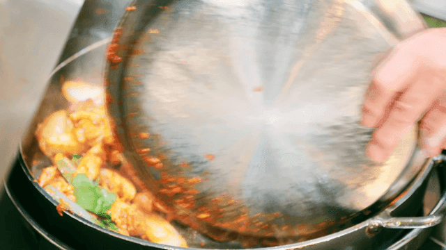 Spicy Dakgalbi dish stir-fried on iron plate